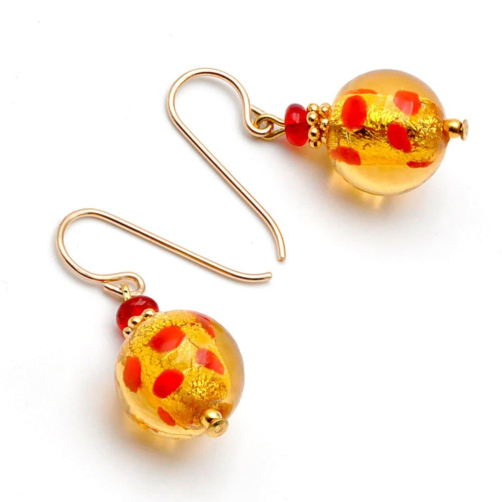 Oorbellen goud en rood van murano-glas rode polka dots