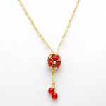 Collier evidence renaissance rouge tisse dore